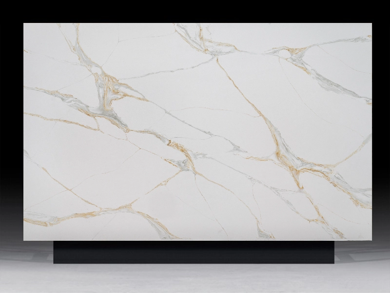 Calacatta Fantasy Gold Quartz countertop with bold golden veining on a white base, ideal for luxurious kitchen and bathroom designs.