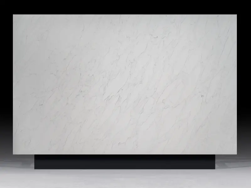 Calacatta Lux Quartz countertop featuring a clean white base with soft gray veining, ideal for modern kitchen and bathroom designs.