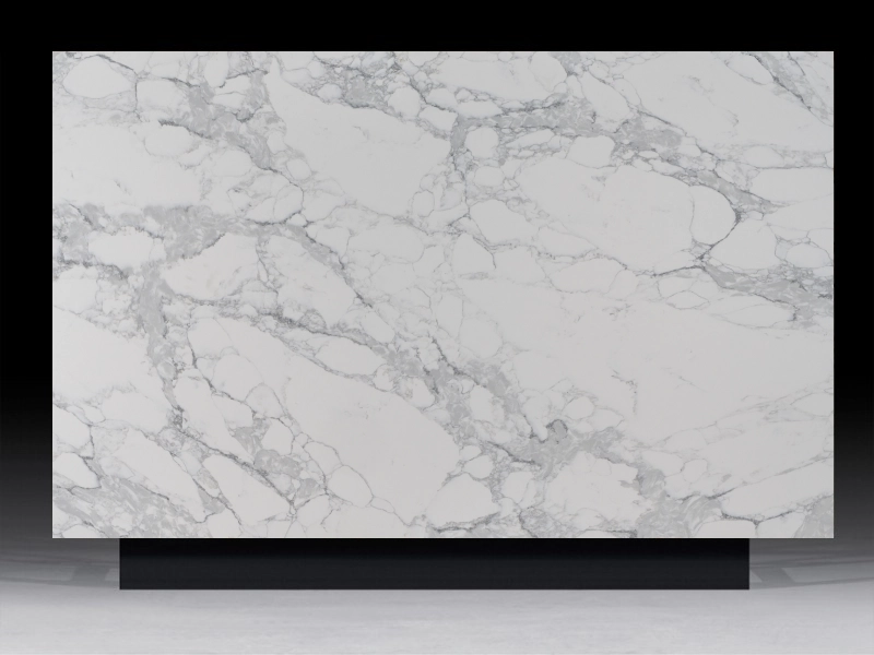 Arabescato Venato Quartz countertop with gray veining on a white base, perfect for modern kitchen and bathroom designs.