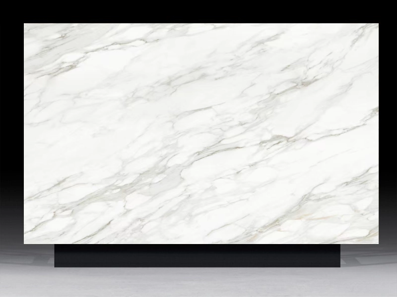 High-definition architectural composite cladding panel featuring the bold, scattered grey and gold veining of Premium Calacatta marble.