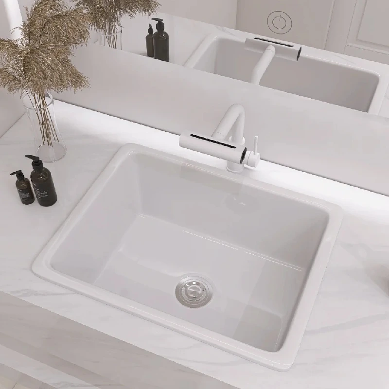 Modern white bathroom vanity featuring a seamless integrated ceramic sink and marble-effect countertop by Miya Stone for luxury interiors.