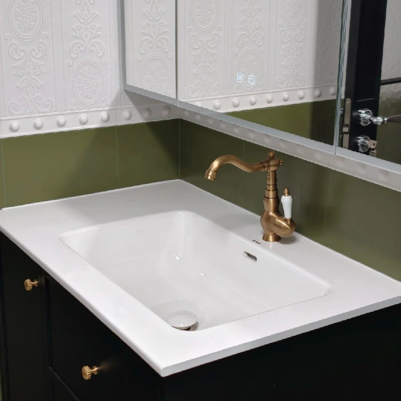 High-gloss white rectangular undermount ceramic sink basin by Miya Stone for luxury hotel bathroom vanity.