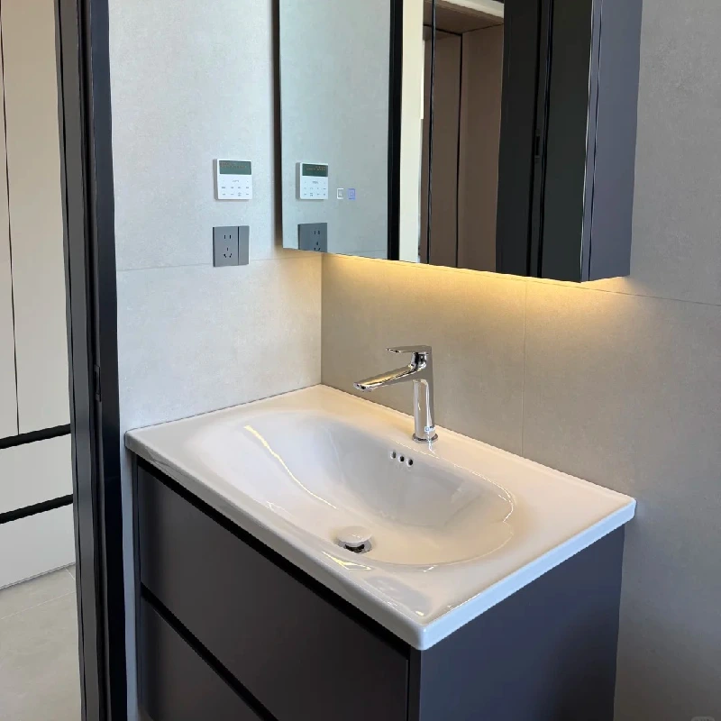 High-gloss white oval porcelain bathroom sink bowl with deep basin design for luxury vanity installations by Miya Stone.
