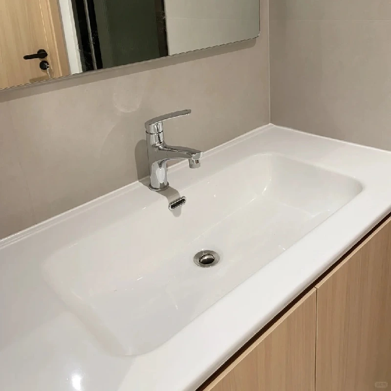 High-volume wholesale bathroom ceramic sink installation for a commercial hospitality project by Miya Stone.